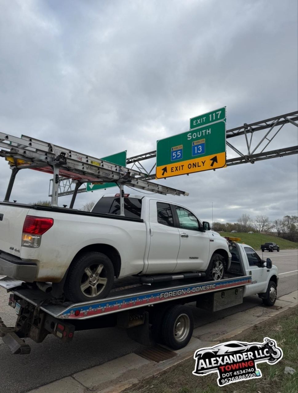 Alexander LLC Towing flatbed truck